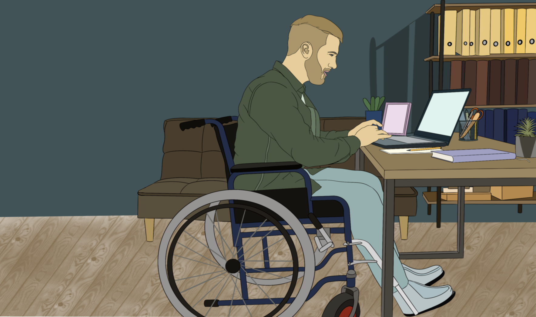 Man in a wheelchair working on his laptop